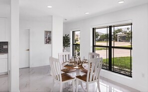 Dining area. Dining table seats 4 with additional seating at kitchen island, bar top table, and kitchen nook area - 4 BR House in Port Charlotte, Charlotte County 5916 (Charlotte County)