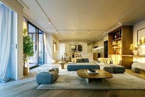 A modern living room with a sofa set, a coffee table, and a large window with curtains. - The Landing Studio 1003 Cape Town CBD (Cape Town)
