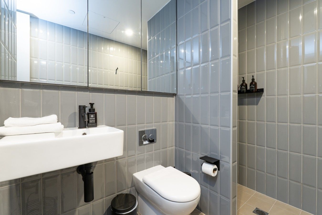 A bright and modern bathroom offering a clean, refreshing space to start the day or unwind with a relaxing shower.