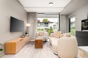 Relax in the inviting living area, thoughtfully styled with comfortable seating and a warm, contemporary feel. - Kingston 1BR in a Central Foreshore Location (Canberra (Inner South))