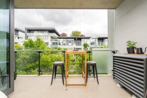 Step outside to enjoy the fresh air on the private patio, a lovely spot to sit back, relax and take in the leafy surroundings. - Kingston 1BR in a Central Foreshore Location (Canberra (Inner South))