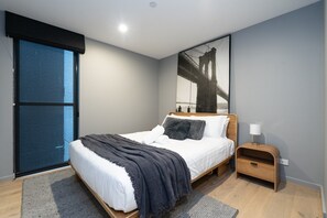Settle into a beautifully styled bedroom with a cosy bed, soft linens and a calming atmosphere designed for a restful night’s sleep. - Kingston 1BR in a Central Foreshore Location (Canberra (Inner South))