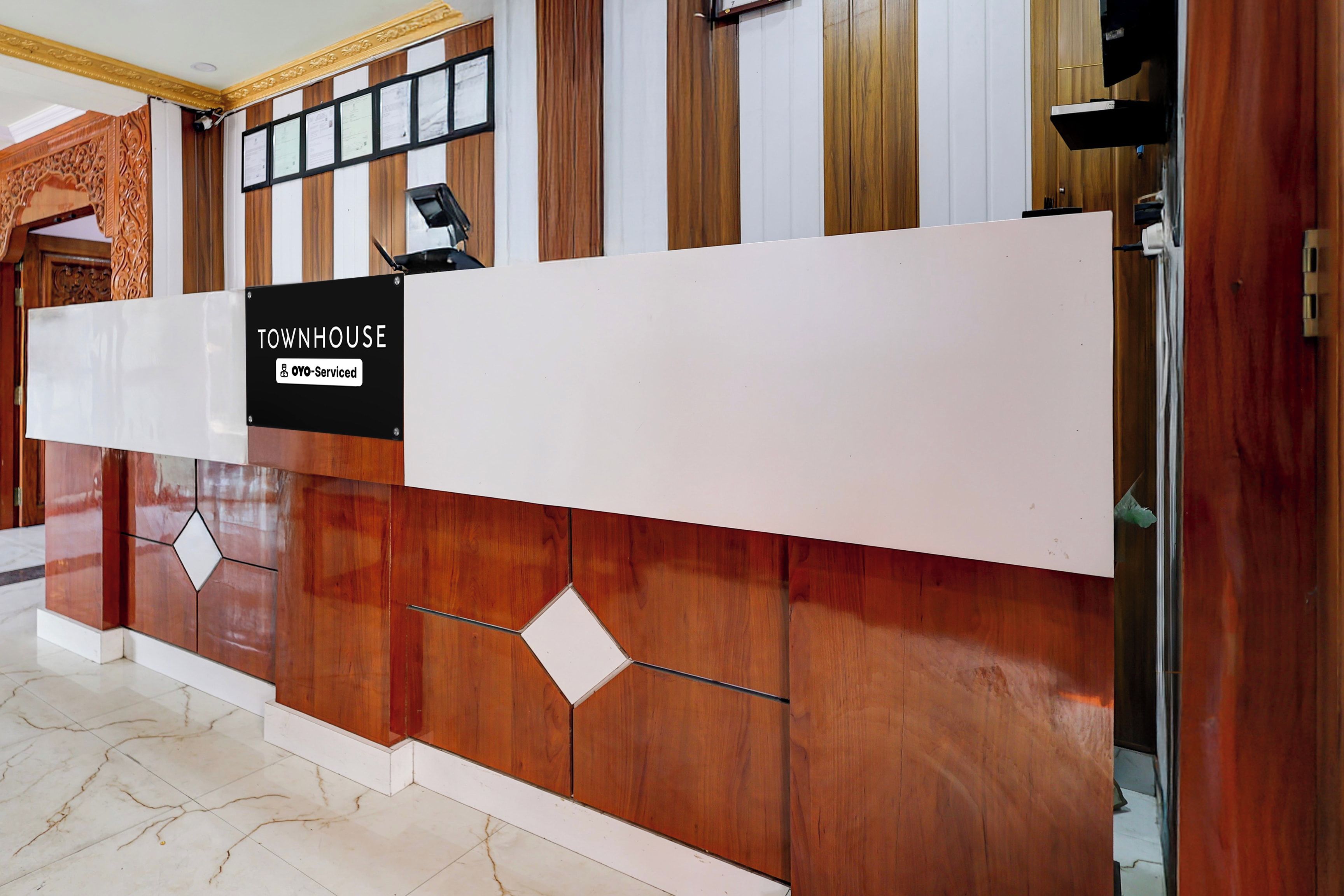 A reception desk with a sign indicating it is serviced by OVO.