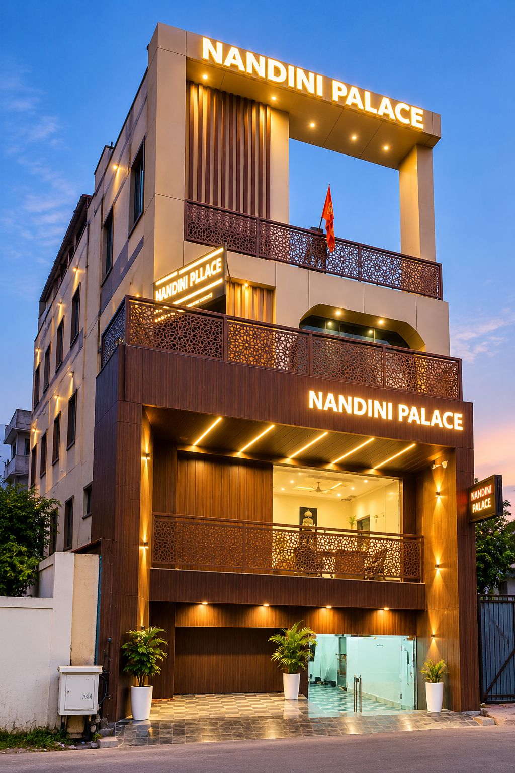 A hotel with a prominent sign reading 'NANDINI PALACE' and a flag above it.
