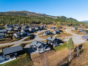 A residential area with houses, roads, and a hilly landscape in the background. - GV19– Family-Friendly Cabin at Trysilfjellet Arena (Trysil)