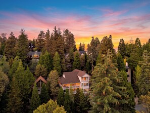 A residential area with multiple houses surrounded by dense forest. - Game Room + Covered Decks + Fire Pit • Near Lake Arrowhead | Wooded Wonder (Lake Arrowhead)