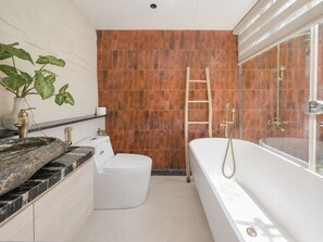 A modern bathroom with a bathtub, toilet, and sink. - The Leaf Eco Villa (Vy Da)