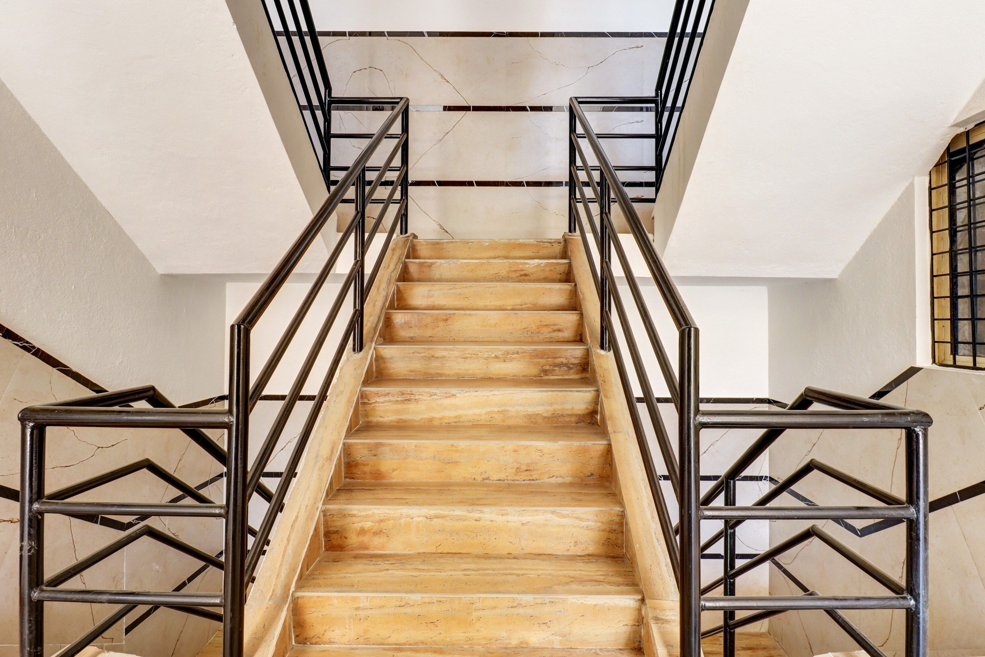 A staircase with wooden steps and metal railings.