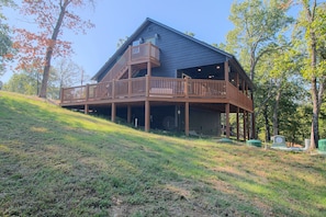 A two-story building with a balcony and a covered outdoor area. - Eucha Home: Grand Lake Views, Boat Ramp Access (Eucha)