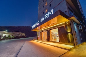 A hotel entrance with a sign reading 'CHARM'. - Echarm Hotel (Guilin)
