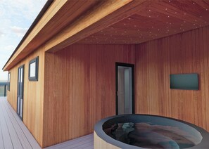 A modern wooden building with a covered outdoor area, a door, and a hot tub. - Autograph Retreat Hot Tub 2 bed Luxury Lodge slps4 (Landford, Nr Salisbury)