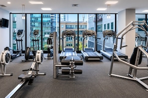 A gym with treadmills, elliptical machines, and weight equipment. - 27th Floor Flagstaff 2 Bedroom (Melbourne)