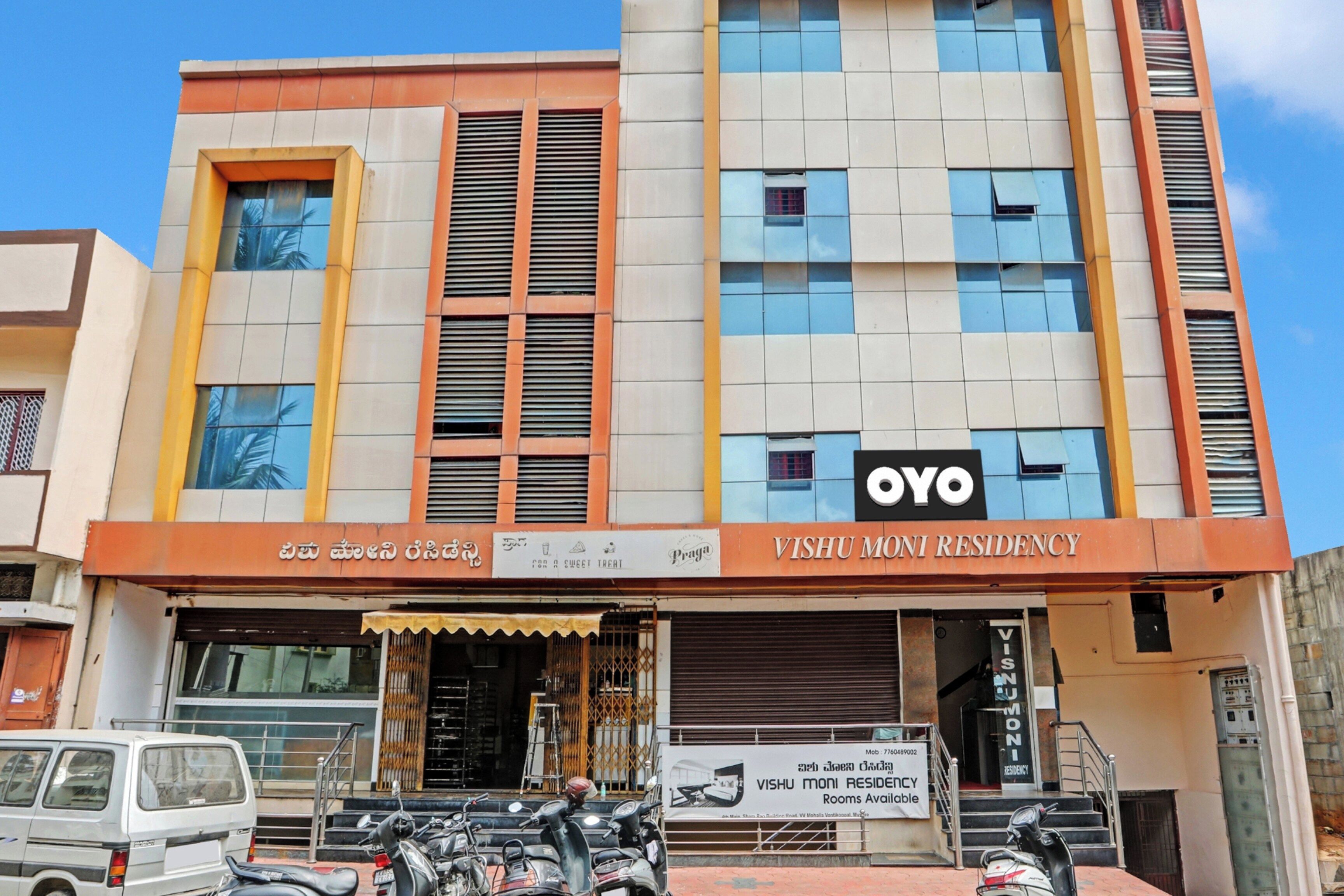A multi-story building with a commercial space on the ground floor.