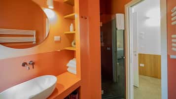 Orange bathroom with shower
