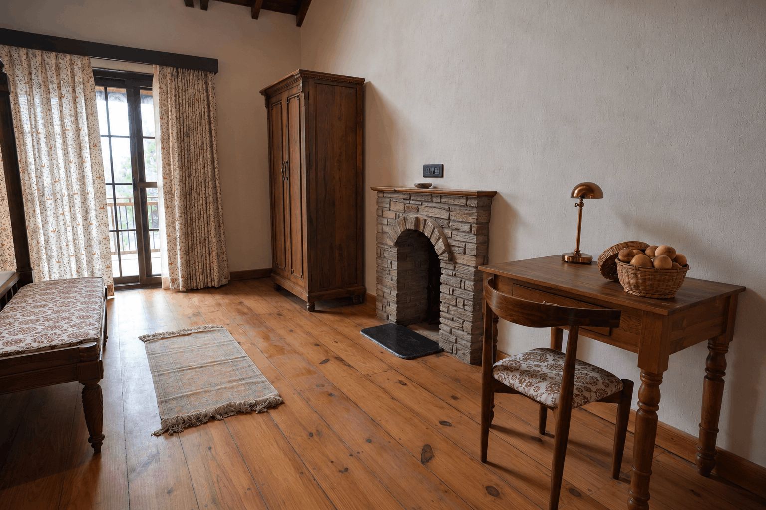 A room with a wooden floor, a fireplace, a wooden cabinet, a table with a lamp, and a chair.