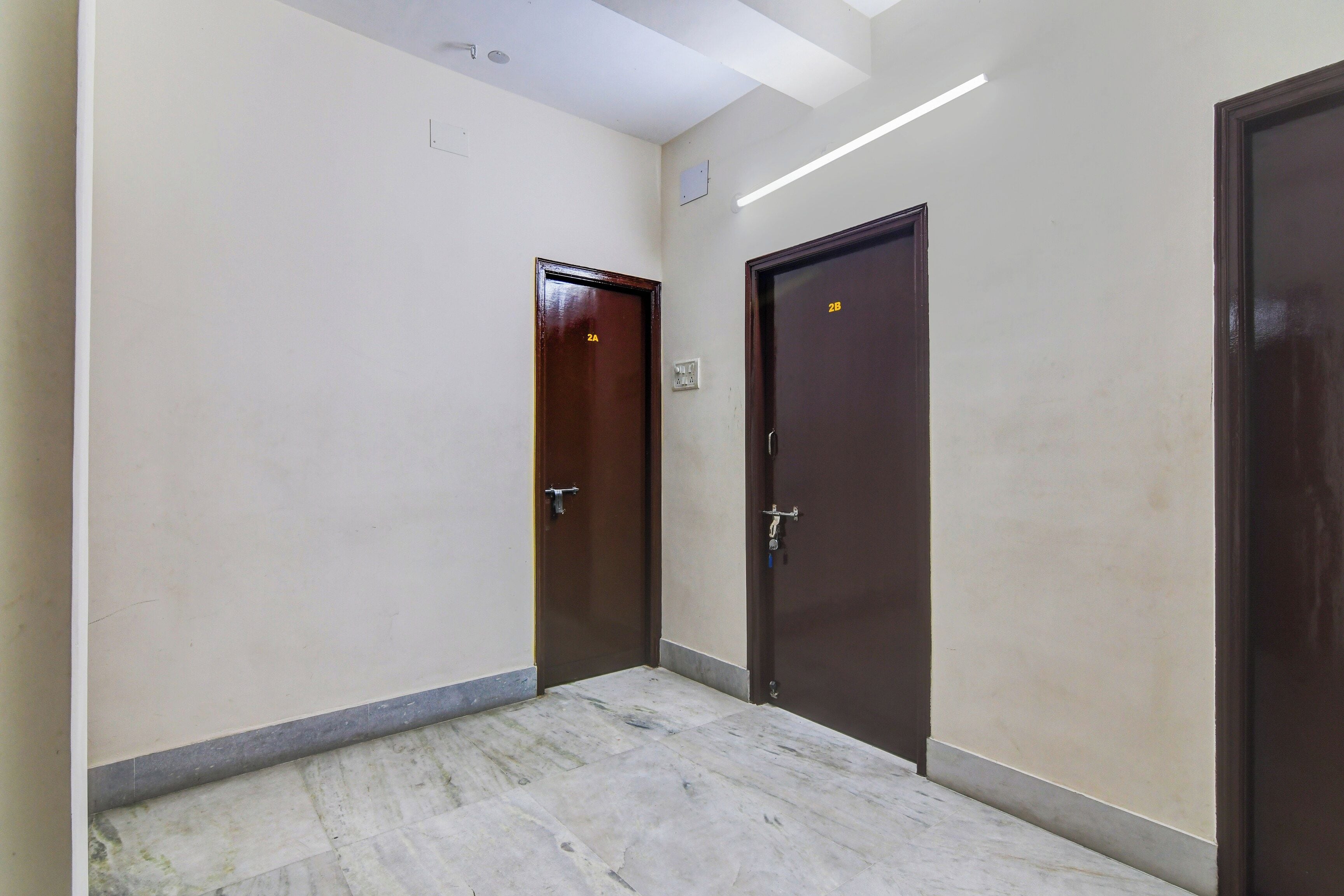 A hallway with two doors, one marked with '2A' and the other with '2B'.