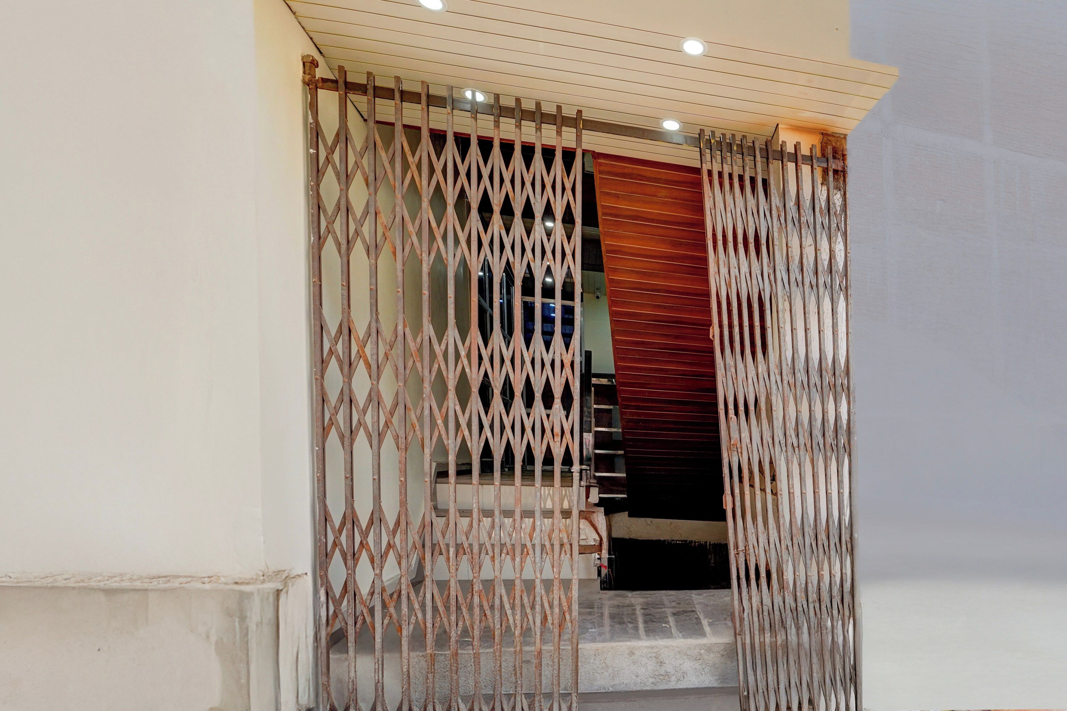 A staircase with a metal gate at the top.
