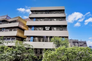 A multi-story building with a prominent sign reading 'HOTELO'.