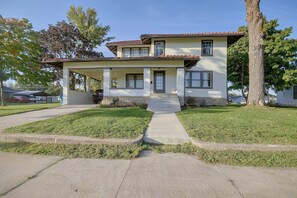 A two-story house with a covered porch, a front yard with grass, and a driveway. - 1 Mi to Culver-stockton College: Home w/ Yard (Canton)