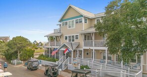 A charming coastal retreat sits nestled among lush greenery in a quiet neighborhood, with welcoming porches and balconies perfect for relaxing after beachside adventures. - This enchanting handicap accessible 1st floor suite is a perfect gateway to enjo (Bald Head Island)