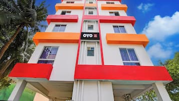 A multi-story hotel with a prominent 'OYO Hotel Love Point' sign.