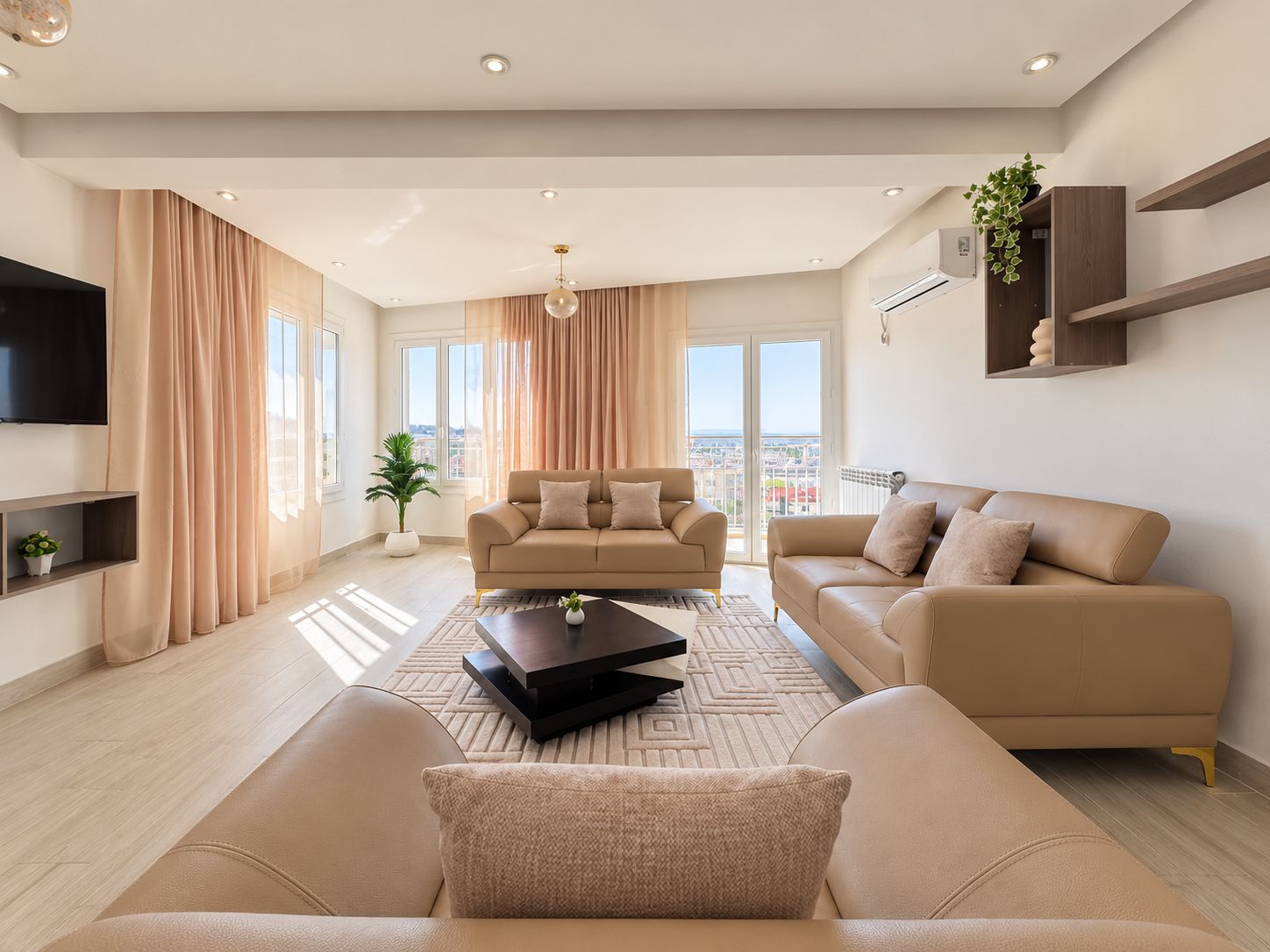 A modern living room with two sofas, a coffee table, and a TV.