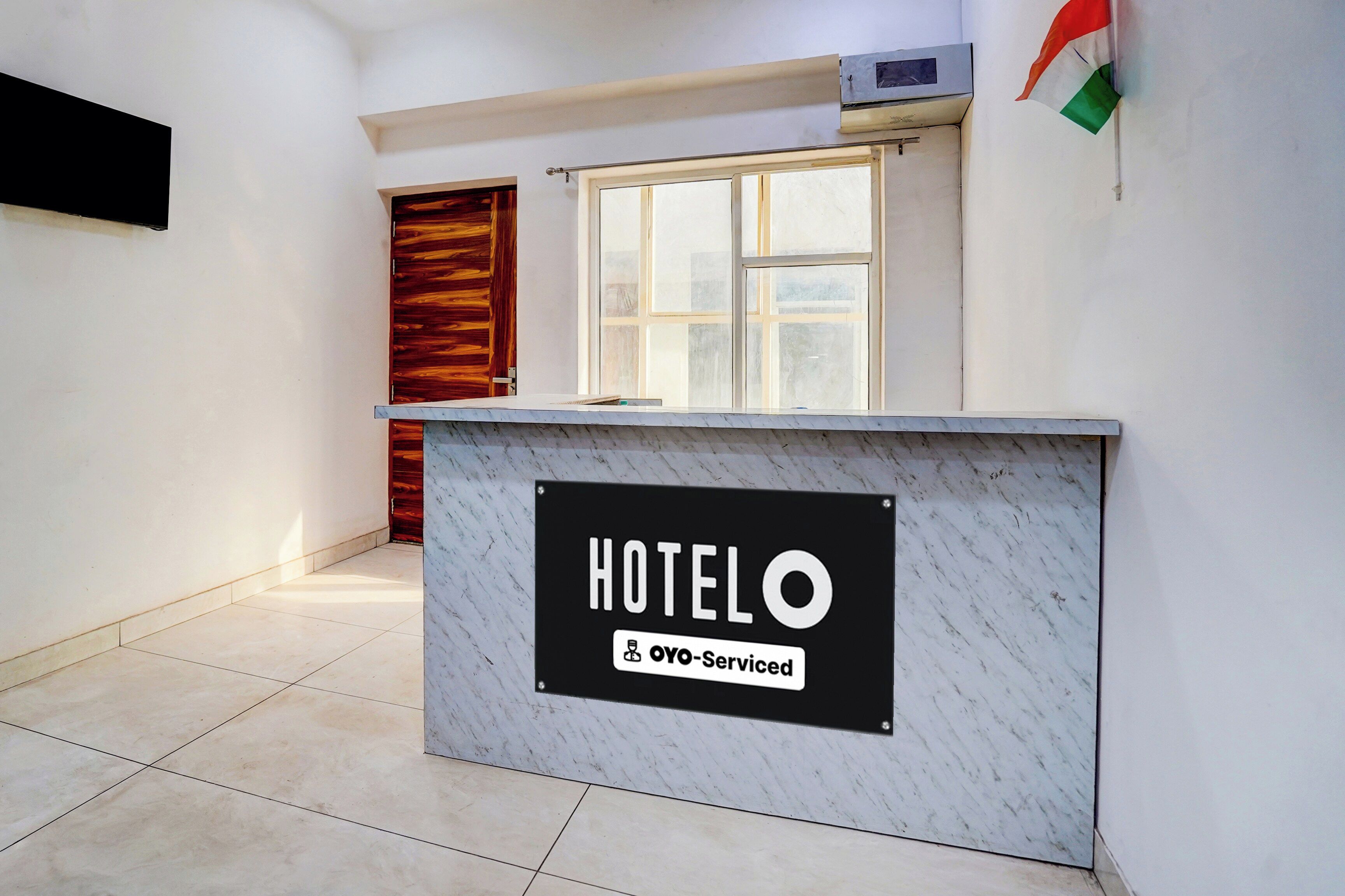 A hotel reception desk with a sign indicating it is 70% serviced.
