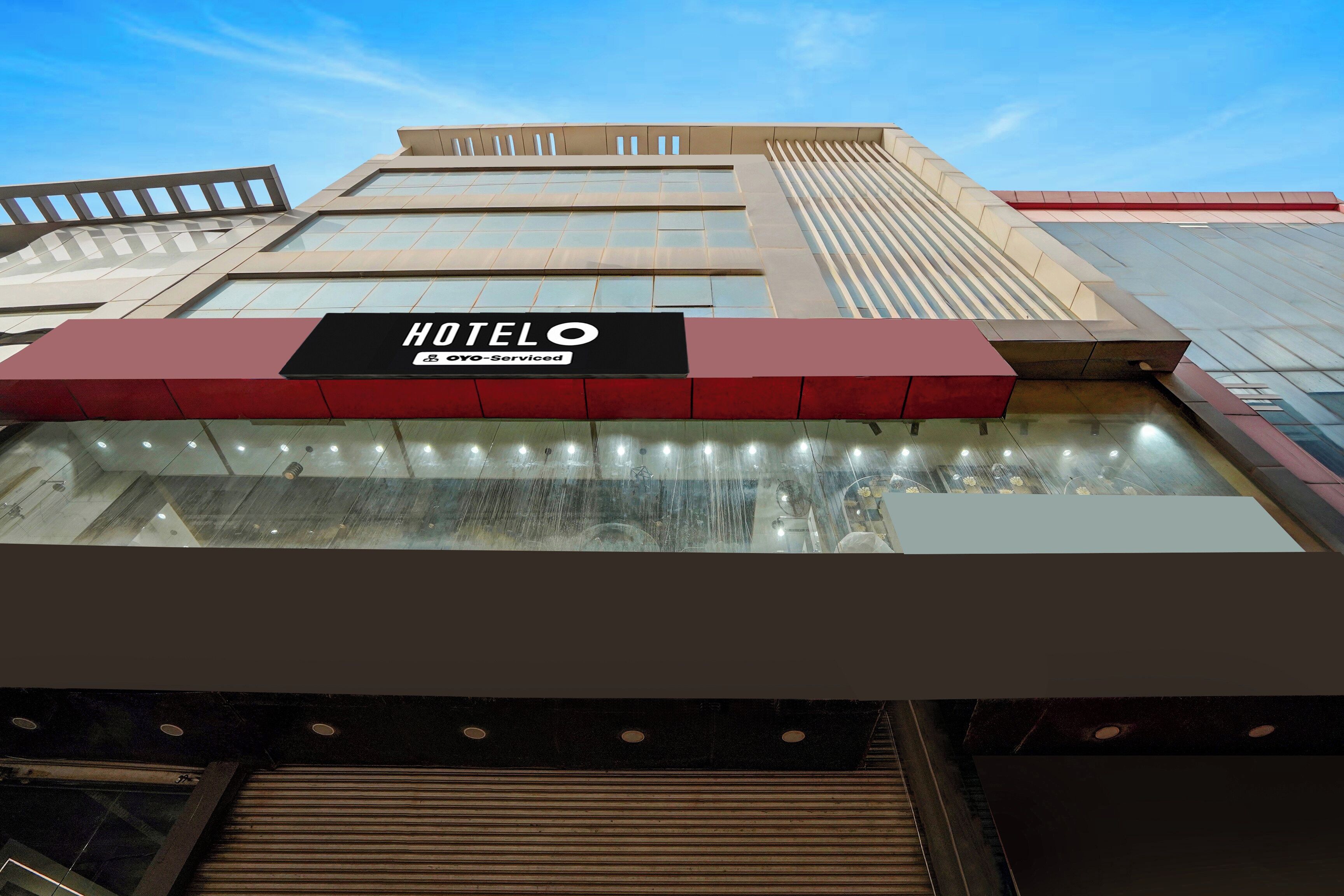 A hotel sign with 'HOTEL' and 'YOYO-Serviced' text.