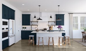 A modern kitchen with dark blue cabinets, white countertops, and a central island with stools. - Marblehead Monthly Stay 5 Bed Lake Retreat 5 Bedroom Home (Marblehead)