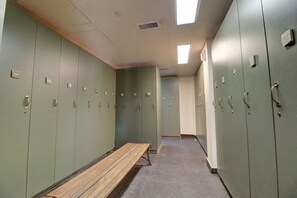 A hallway with lockers and a bench. - Cs322 Copper Springs 2 Bedroom Condo (Copper Mountain)