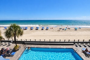 A poolside area with a clear view of the beach and ocean. - 0211 Waters Edge Resort 2 Bedroom Condo (Murrells Inlet)
