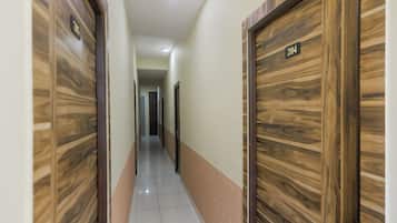 A hallway with wooden doors, numbered 204 and 205, leading to rooms.