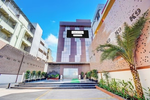 A modern building with a sign reading 'PALETTE Company Serviced'.
