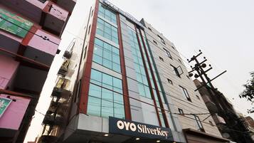 A multi-story building with a prominent 'OYO Silverkey' sign at the bottom.