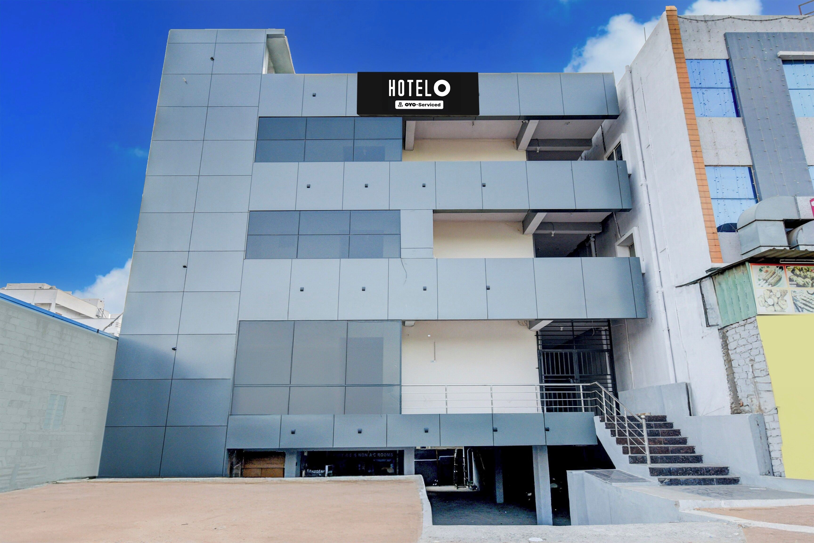 A hotel building with a sign indicating it is serviced by YOYO.