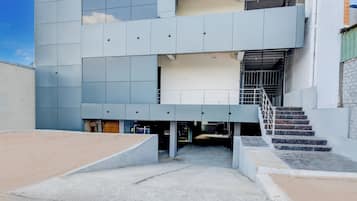 A multi-level building with a staircase leading to an upper floor.
