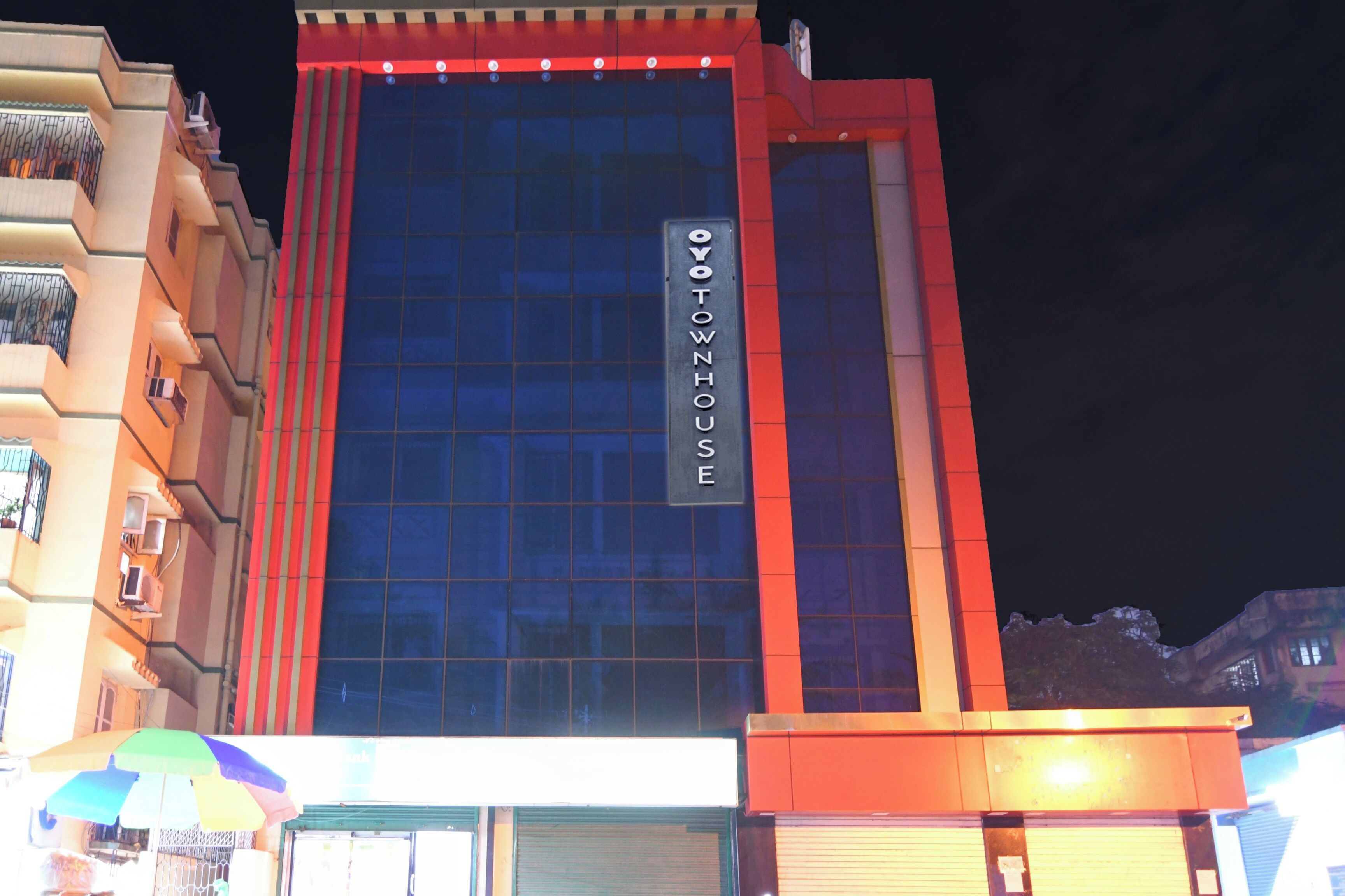 A multi-story building with a prominent sign reading 'YOYOTOWNHOUSE'.