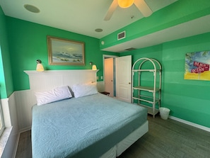 A room with a bed, a painting, a ladder, and a door. - Old-Florida Resort, Steps to Beach & Village, Heated Pool (Siesta Key)