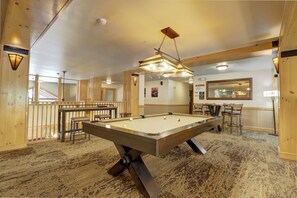 A pool table in a room with wooden walls and a carpeted floor. - Copper Springs Getaway with Great Ski Access (Copper Mountain)
