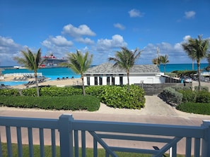 A resort with a pool, palm trees, and a view of the ocean. - "Beach, Please!" Ocean View Townhome.  Three bed, three bath.  Sleeps 10. (Bimini Bay)