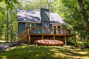 A house with a deck, a chimney, and a covered outdoor area. - Newly Remodeled 3-bedroom escape nestled in the woods of Jim Thorpe Pennsylvania (Jim Thorpe)