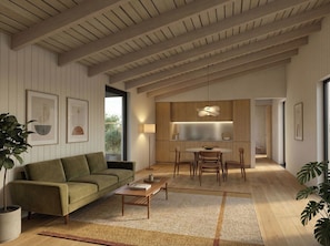 A modern living space with a sofa, coffee table, and dining area, featuring wooden beams and a large window. - Arbora 2.0 Spa (Malvern)
