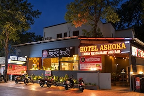 A hotel with a sign indicating 'Hotel Ashoka' and 'Family Restaurant and Bar' with a 'Lodging' sign. - Hotel Ashoka Inn (Pimpri-Chinchwad)