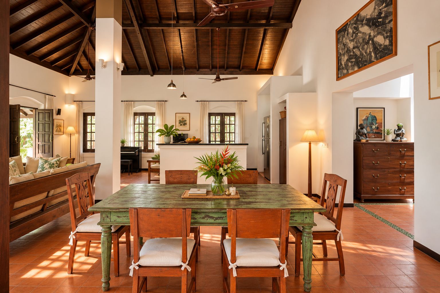 A dining area with a wooden table and chairs, a vase with flowers, and a piano in the background.