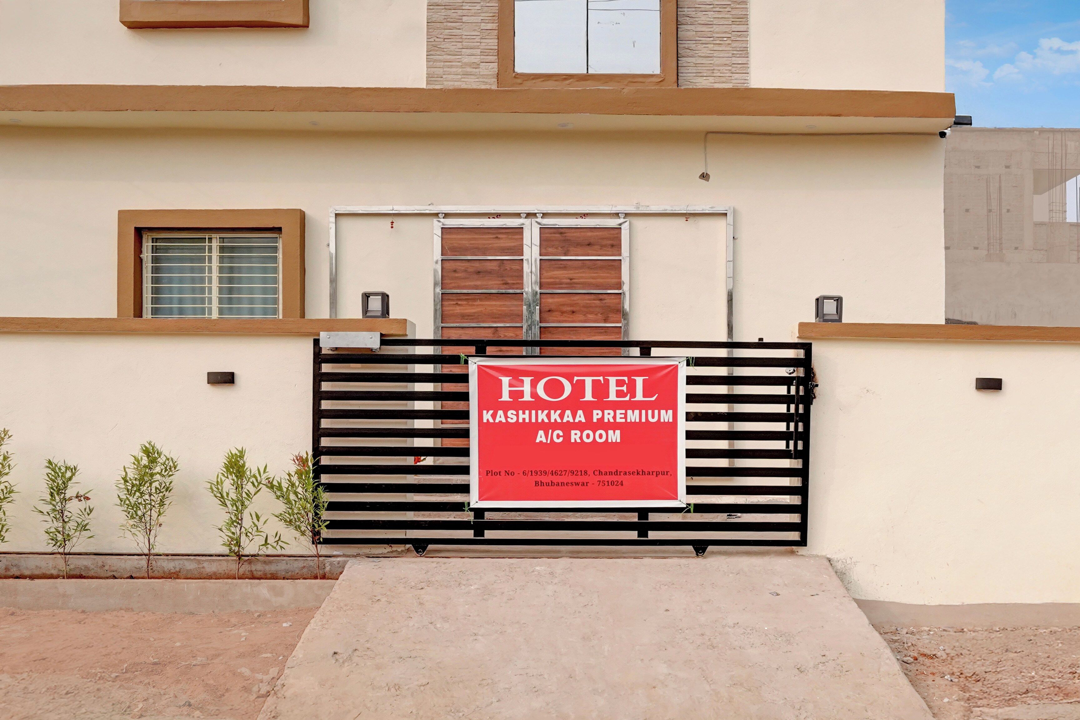 A hotel entrance with a gated A/C room.