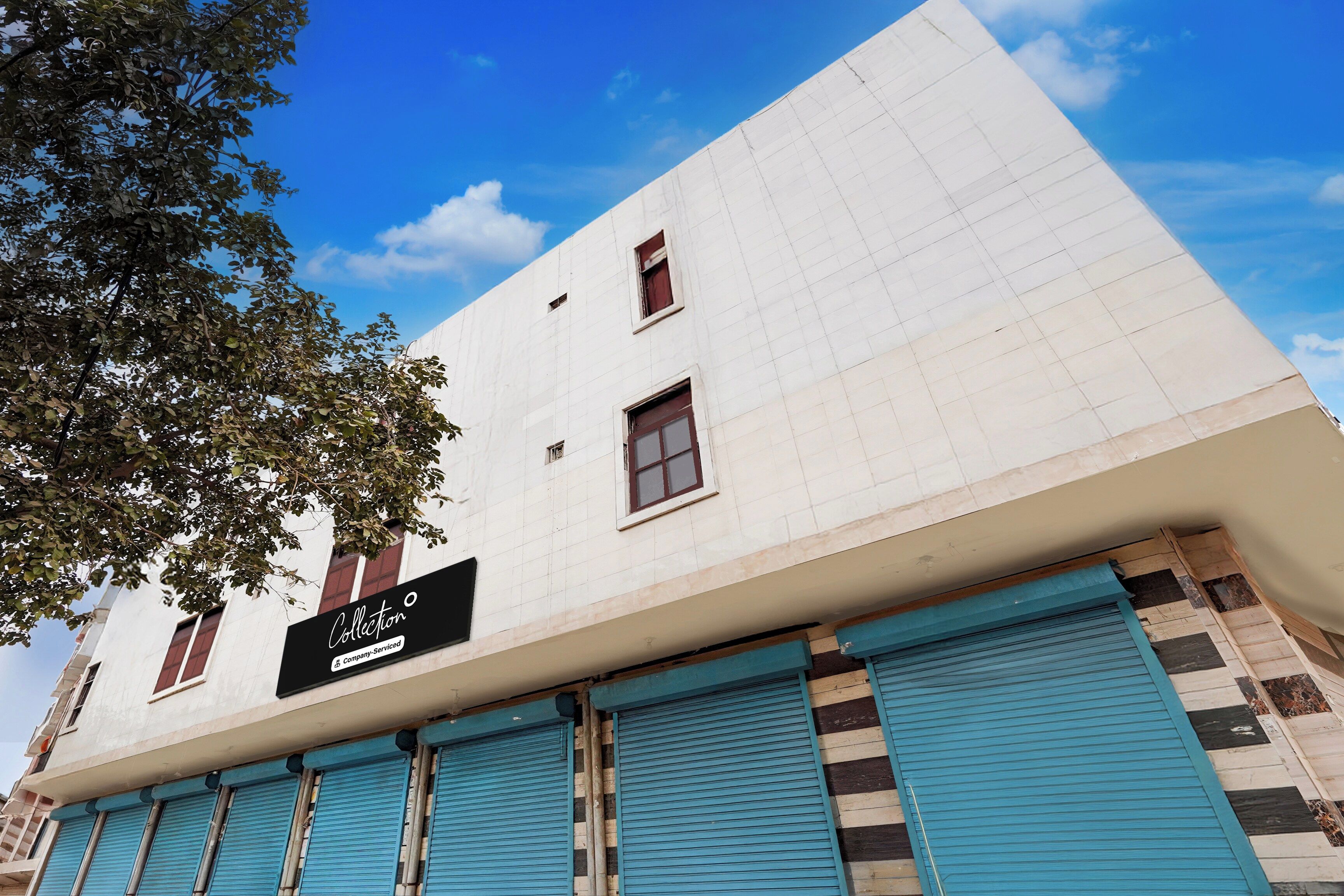 A building with a sign that reads 'Collection Company-Serviced'.