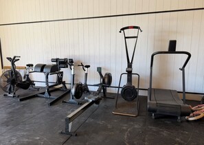 A row of stationary exercise equipment against a wall. - Charming 10 acre homestead stay in Ennis (Ennis)