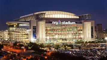 A large, multi-level stadium with a prominent 'nrg stadium' sign.