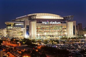 A large, multi-level stadium with a prominent 'nrg stadium' sign. - Rosie Blush 1BR 2 Beds | 5 Min Walk NRG | Near TMC (Houston)