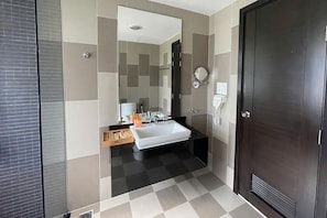A modern bathroom with a large mirror, a sink, and a toilet. - Elegant Pool Villa My Khe Beach Danang (Da Nang Municipality)